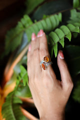 Red Kyanite Ethiopian Kyanite adjustable ring shown worn on the hand, with high-shine 925 sterling silver and oxidized texture.
