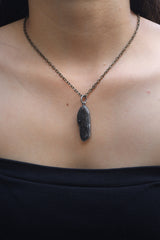 Torrington Smoky Citrine pendant worn on a model with brass necklace and oxidized silver setting.
