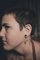 Brown Dravite Tourmaline and Clear Quartz earrings shown worn from the side, with polished silver stud and crystal drop.
