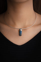 Azurite Stack Pendant shown worn on the chest with sterling silver cap and deep blue copper mineral stone.