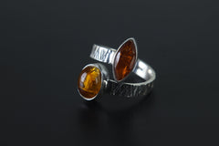 Close-up of Red Faceted Kyanite and Ethiopian Kyanite in a 925 sterling silver open-band ring.