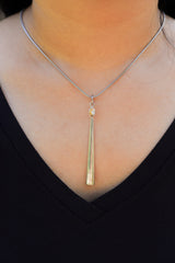 Herkimer Diamond sterling silver spoon pendant shown worn on a model as a clean sculptural crystal necklace.