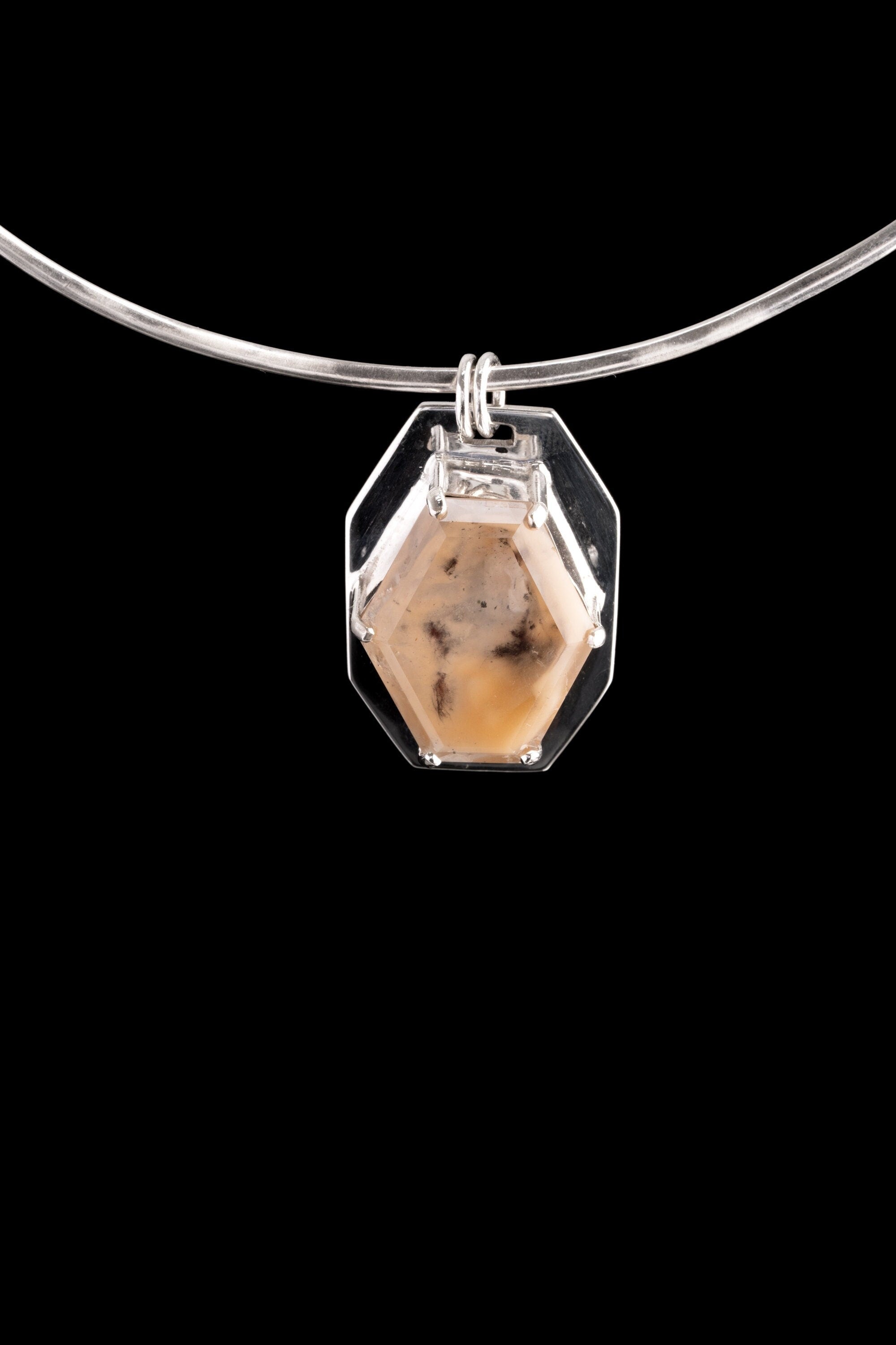 Madagascar Inclusion Quartz pendant displayed on choker with high-shine sterling silver claw setting.