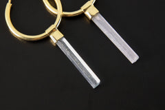 Close-up of Australian Aquamarine convertible earrings showing pale blue crystals and warm gold-plated silver hoops.