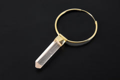 Lemurian Quartz hoop earring pendant shown on dark background with large gold hoop and clear crystal charm.