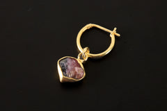 Rubellite Pink Tourmaline hoop earring shown on dark background with gold-plated sterling silver and pink gemstone slice.