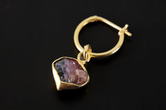 Close-up of Rubellite Pink Tourmaline charm showing natural gemstone texture and warm gold-plated silver setting.