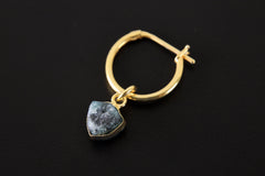 Blue Tourmaline dangle hoop earring shown on dark background with gold-plated sterling silver and blue gem slice.