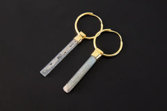 Gold-plated Australian Aquamarine hoop earrings shown on a dark background with slim blue crystal charm drops.
