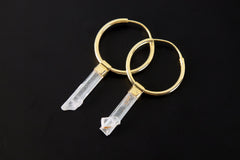 Gold-plated Aquamarine hoop earrings shown on a dark background, with pale Australian gem crystals and circular hoops.