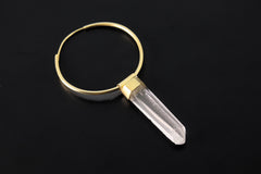 Lemurian Quartz gold-plated sterling silver dangle hoop earring shown on dark background with clear crystal point.