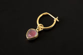 Watermelon Tourmaline gold-plated sterling silver hoop earring shown on dark background with pink green gem slice.