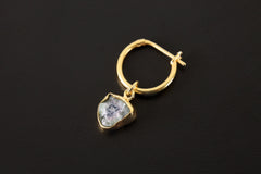 Watermelon Tourmaline dangle hoop earring shown on dark background with gold-plated sterling silver and pink green stone.