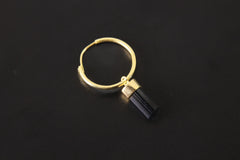 Black Tourmaline single hoop earring shown on dark background with gold-plated sterling silver hoop and charm.