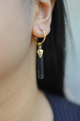 Watermelon Tourmaline gold-plated sterling silver dangle hoop earring worn on a model as a single charm.