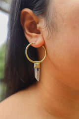 Lemurian Citrine gold-plated sterling silver hoop earring worn on a model as a single dangle crystal charm.
