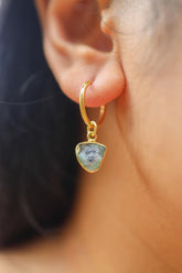 Watermelon Tourmaline gold-plated sterling silver dangle hoop earring worn on a model as a single charm.
