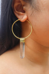 Golden Lemurian Quartz Spirit earring pendant worn on a model as a large single crystal hoop.