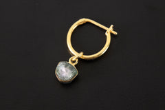 Blue Tourmaline single hoop earring shown on dark background with gold-plated sterling silver hoop and charm.