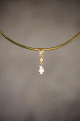 Close-up of Blue Moonstone Opal Shell pendant showing square Moonstone, faceted Ethiopian Opal, white shell, and gold-plated setting.