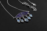 Charoite Blue Moonstone eye necklace in high-shine 925 sterling silver with purple centre stone and five teardrop Moonstone dangles.