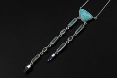 Larimar Aquamarine Herkimer Quartz necklace shown on a dark background with two dangling crystal strands and sterling silver chain.
