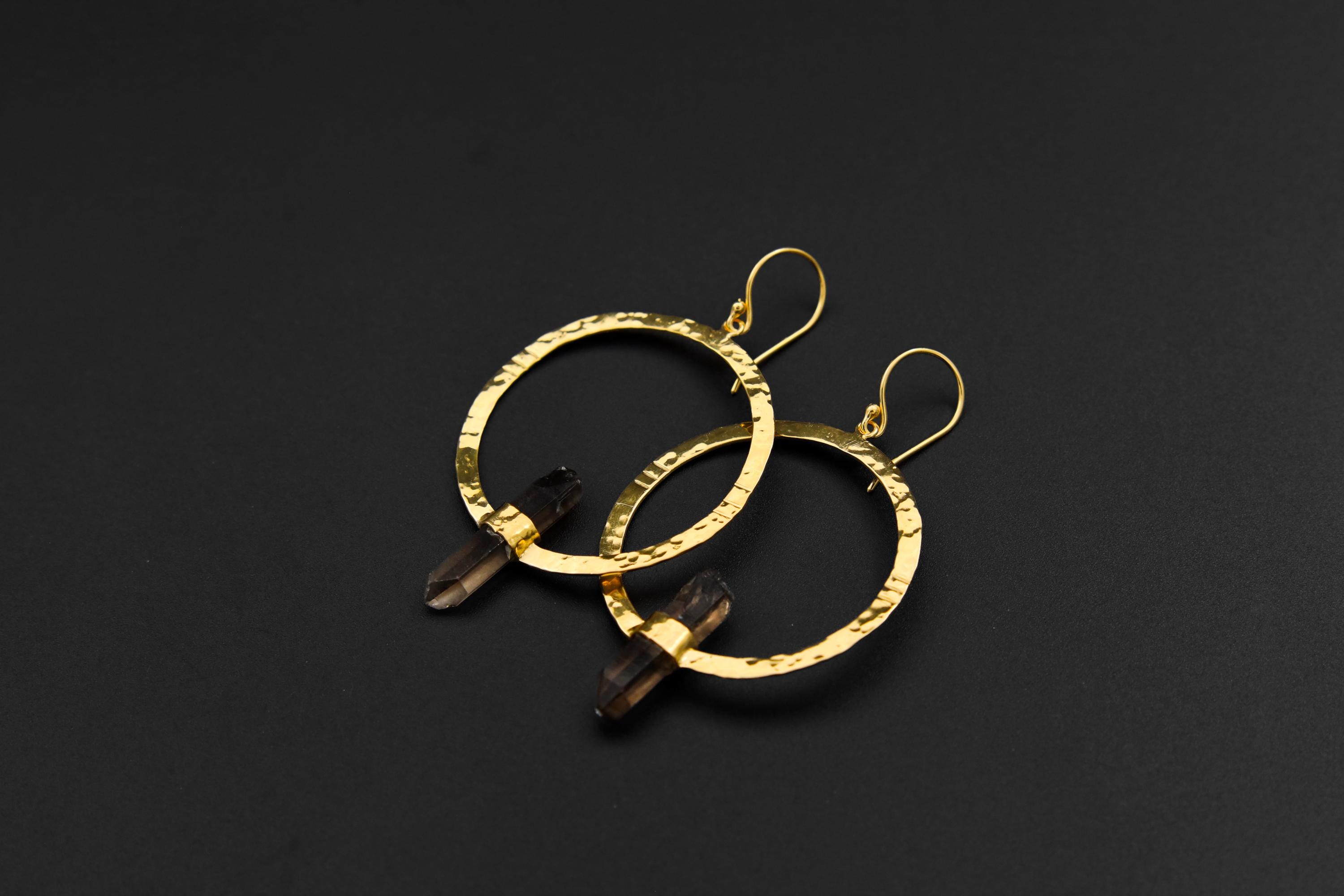 Australian Smoky Quartz portal earrings shown on dark background with textured silver circles and raw crystal points.