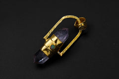 Spinning Vera Cruz Amethyst and Opal Pendant shown on black background with violet Amethyst point and polished silver frame.