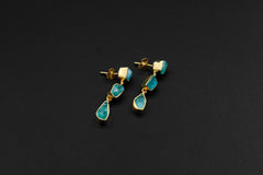 Pair of raw Blue Apatite gold-plated drop earrings with organic silver forms and three crystal dangles on each earring.