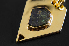 Close-up of pentagonal Green Tourmaline pendant with dark green polished stone and 18k gold-plated sterling silver setting.