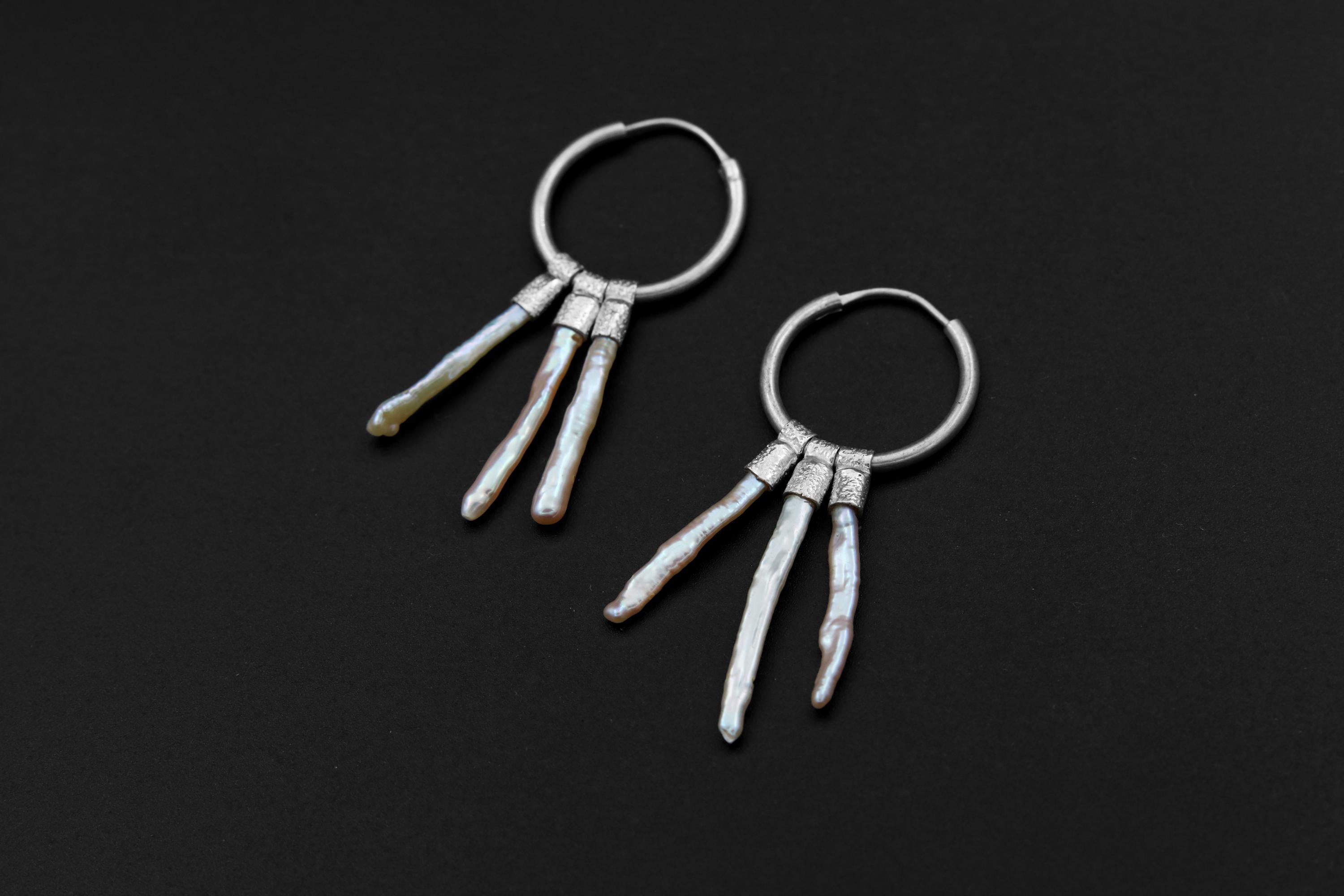 Moonlit Pearl stack hoop earrings shown on dark background with large sterling silver hoops and three Pearl dangles.