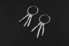 Moonlit Pearl stack hoop earrings shown on dark background with large sterling silver hoops and three Pearl dangles.