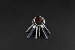 Clear Quartz Pearl stack hoop earrings shown on dark background with sterling silver hoops and luminous crystal dangles.