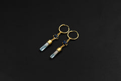 Sapphire and Aquamarine gold-plated hoop earrings shown on dark background with petite 18k gold sterling silver hoops.