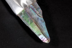 Close-up of Double Terminated Angel Aura Quartz point showing rainbow sheen, natural crystal form, and luminous surface.