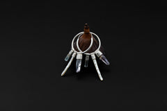 Crystal stack hoop earring worn on a model, showing large sterling silver hoop and layered gemstone movement.