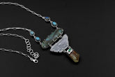 Harmony Labradorite Kunzite Apatite Emerald necklace shown worn on a model, with sterling silver Cuban link chain and statement pendant.