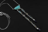 Atlantian Larimar Ocean Talisman shown on a dark background with Larimar, Aquamarine, Herkimer Diamond, Vera Cruz Quartz, and sterling silver chain.