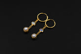 Golden Ethiopian Opal and Pearl hoop earrings in 18k gold-plated 925 sterling silver with gemstone dangles.