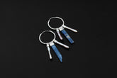 Blue Kyanite Pearl stack hoop earrings shown on dark background with sterling silver hoops and blue crystal dangles.