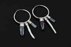 Celestial Gatherer crystal stack hoop earrings shown as a pair with Smoky Quartz, Amethyst, Tourmaline, Pearl, and Quartz.
