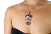 Azurite Aquamarine Kyanite pendant worn on model with oxidized sterling silver and layered blue stones.