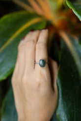 Handmade 925 sterling silver Blue Tourmaline ring shown worn on the hand, with a deep blue gemstone and sturdy silver band.
