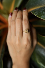 Gold-plated Pyrite ring shown worn on a hand, with warm golden shine and handmade sterling silver setting.
