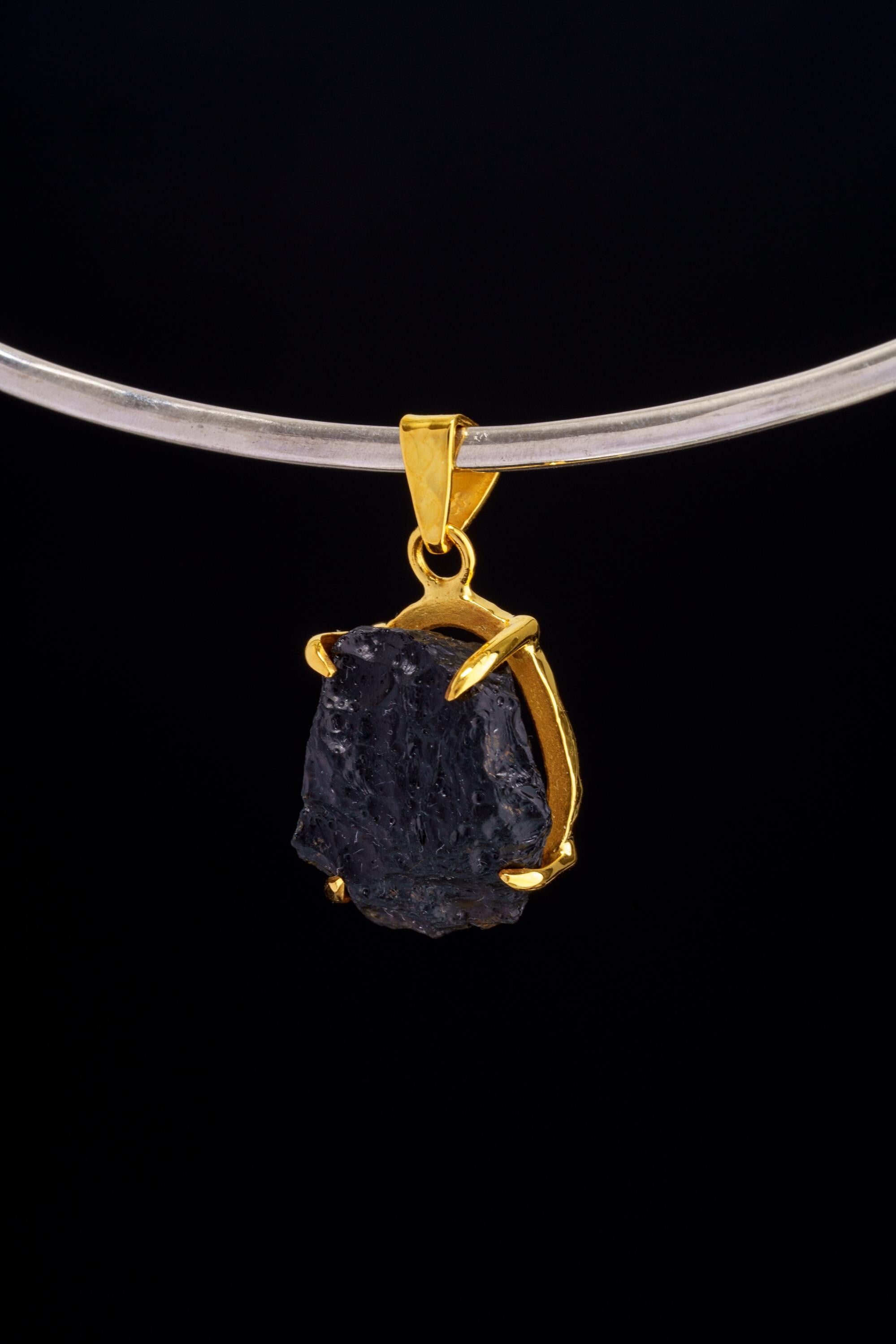 Darwin Glass Tektite pendant displayed on choker with gold-plated sterling silver setting.