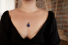 Brazilian Lapis Lazuli pendant shown worn on a model, with oxidized sterling silver setting and deep blue stone.