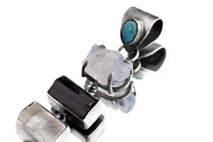 Close-up of Apatite Tanzanite Tourmaline Selenite Amethyst pendant in oxidized brushed sterling silver.