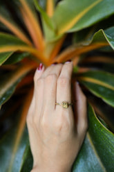 Gold-plated 925 sterling silver Pyrite ring shown worn on the hand, with a metallic golden stone and sturdy handmade band.