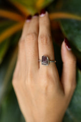 Handmade 925 sterling silver Pink Tourmaline ring shown worn on the hand, with a deep rose gemstone and sturdy silver band.