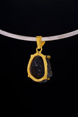Darwin Glass pendant worn on choker against black background as a Crown Chakra cosmic talisman.